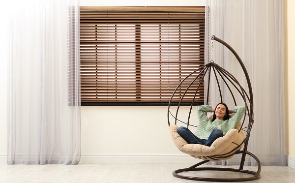 Relaxing after removing and replacing your outdated blinds with new custom blinds from Blindsgalore