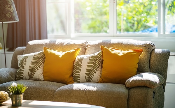 a beautiful living room with plenty of incoming glare from a window that needs to be covered a beautiful living room with plenty of incoming glare from a window that needs to be covered